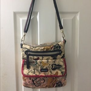 SAKROOTS PEACE CROSSBODY